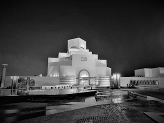 An elegant photo of a modern museum exterior captured with artistic lighting.