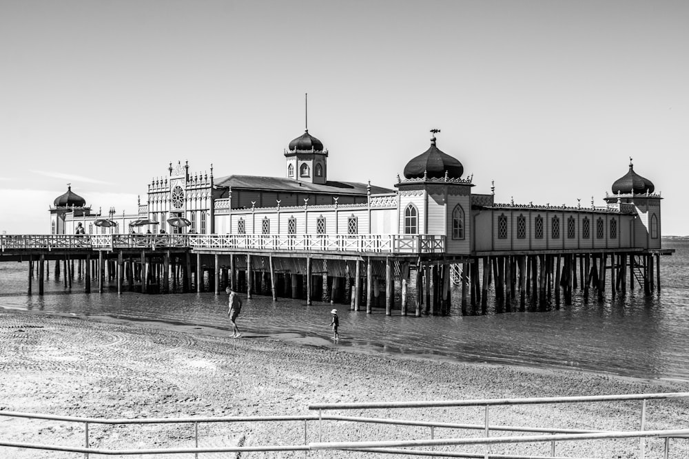 grayscale photography of pier