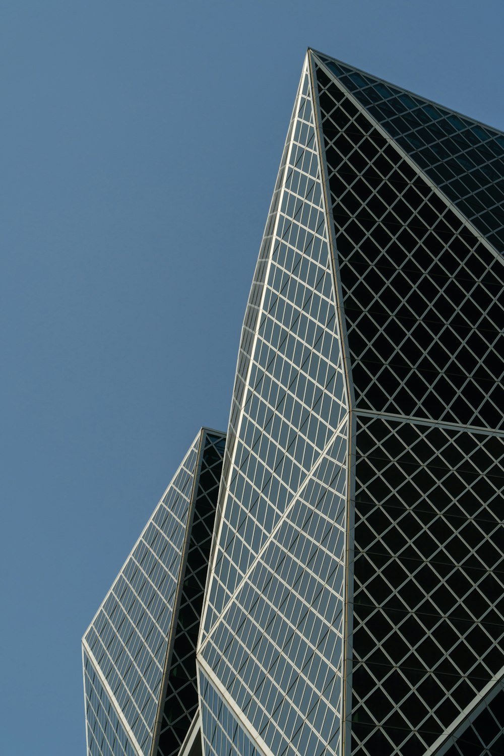 concrete curtain glass building during daytime