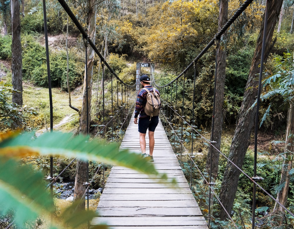 man crossing the bridge