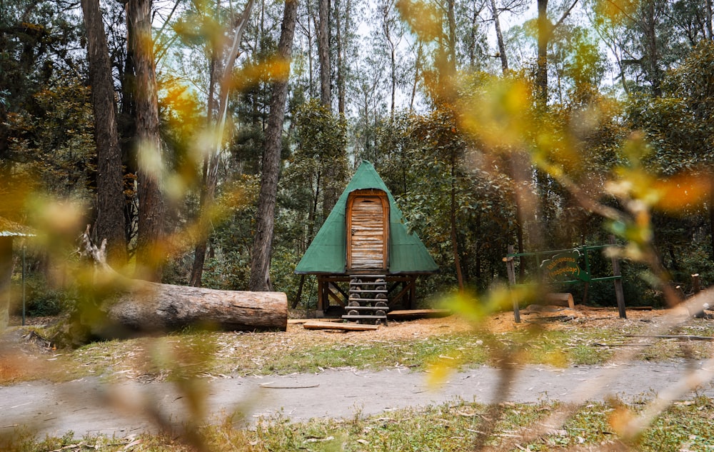 green and brown wooden house under green trees