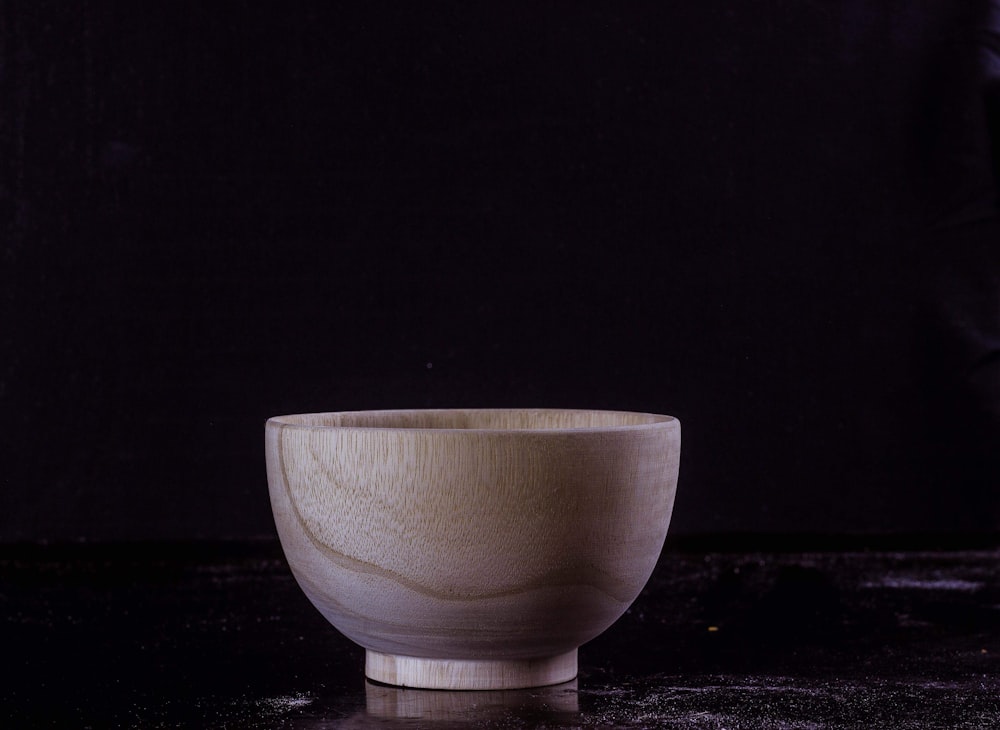 gray and brown wooden bowl on white surface