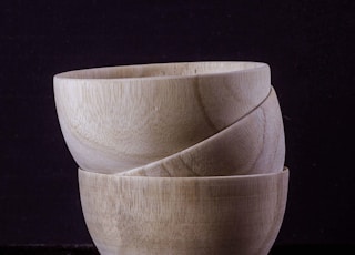 three brown ceramic bowl