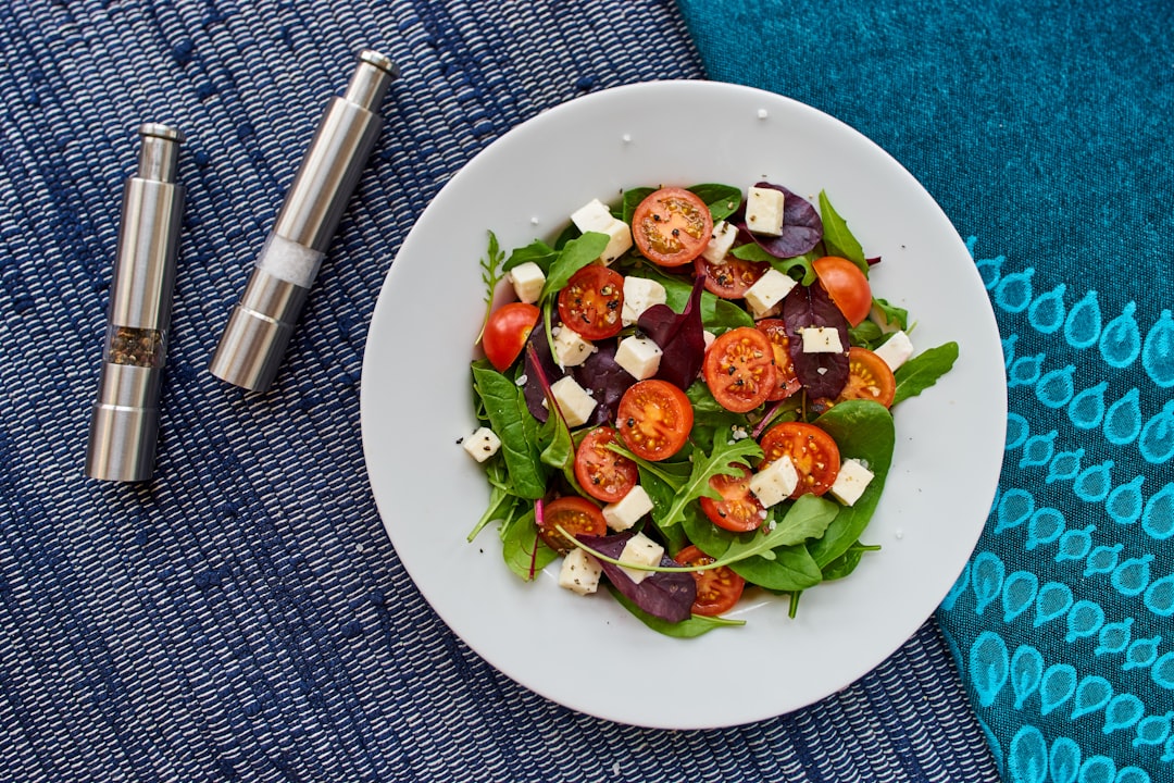 vegetable salad on round white ceramic plate, There is no better way than start your day with a tomato mozzarella salad!