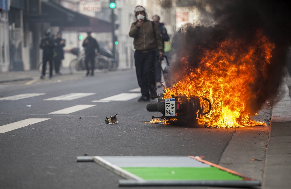 motorcycle burning in the middle of the road