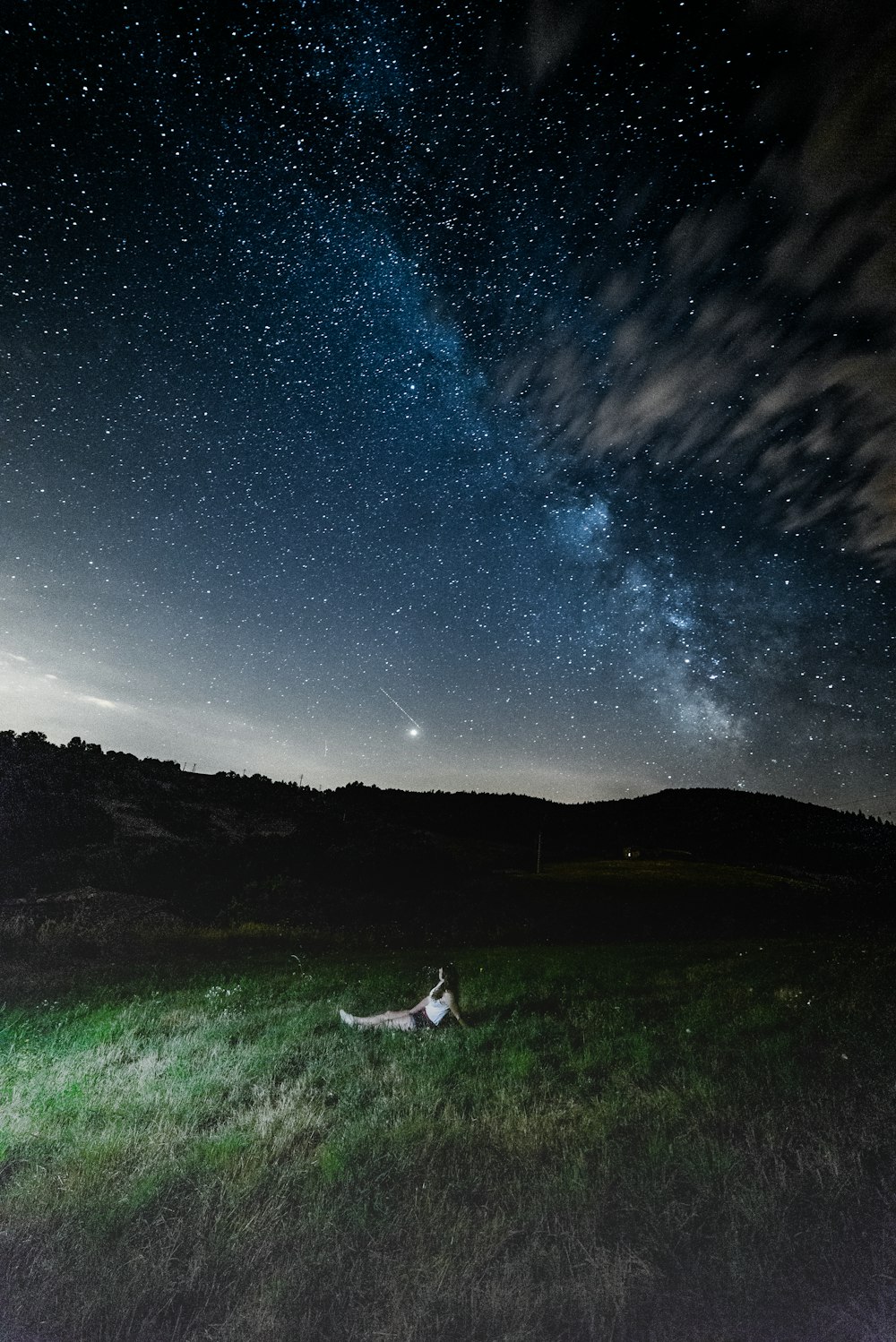 woman sitting under milkyway