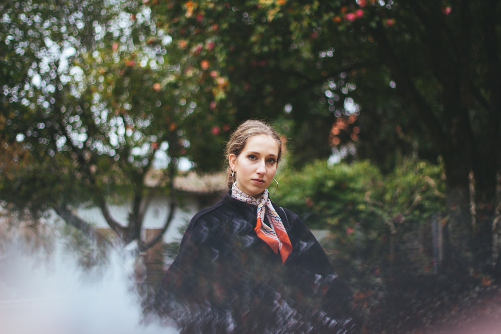 woman leaning on fence