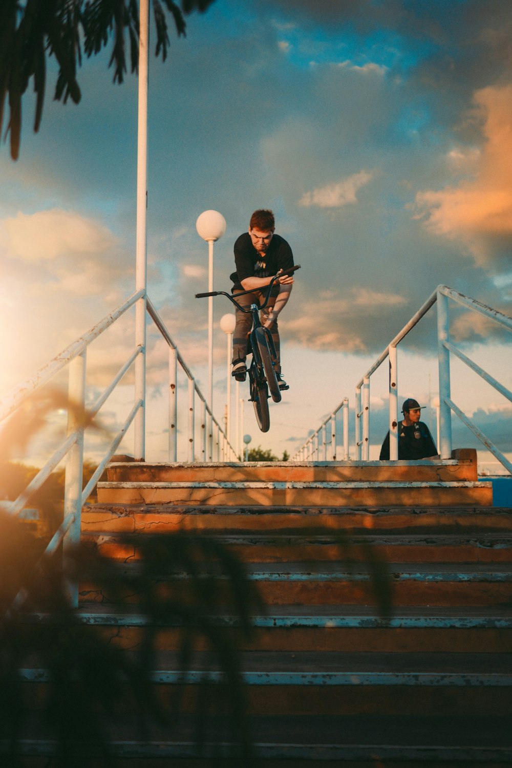 man in black sweater riding bicycle during daytime