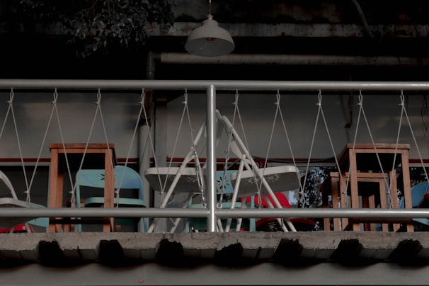 A balcony storage scene displaying durable folding storage boxes arranged to maximize space.