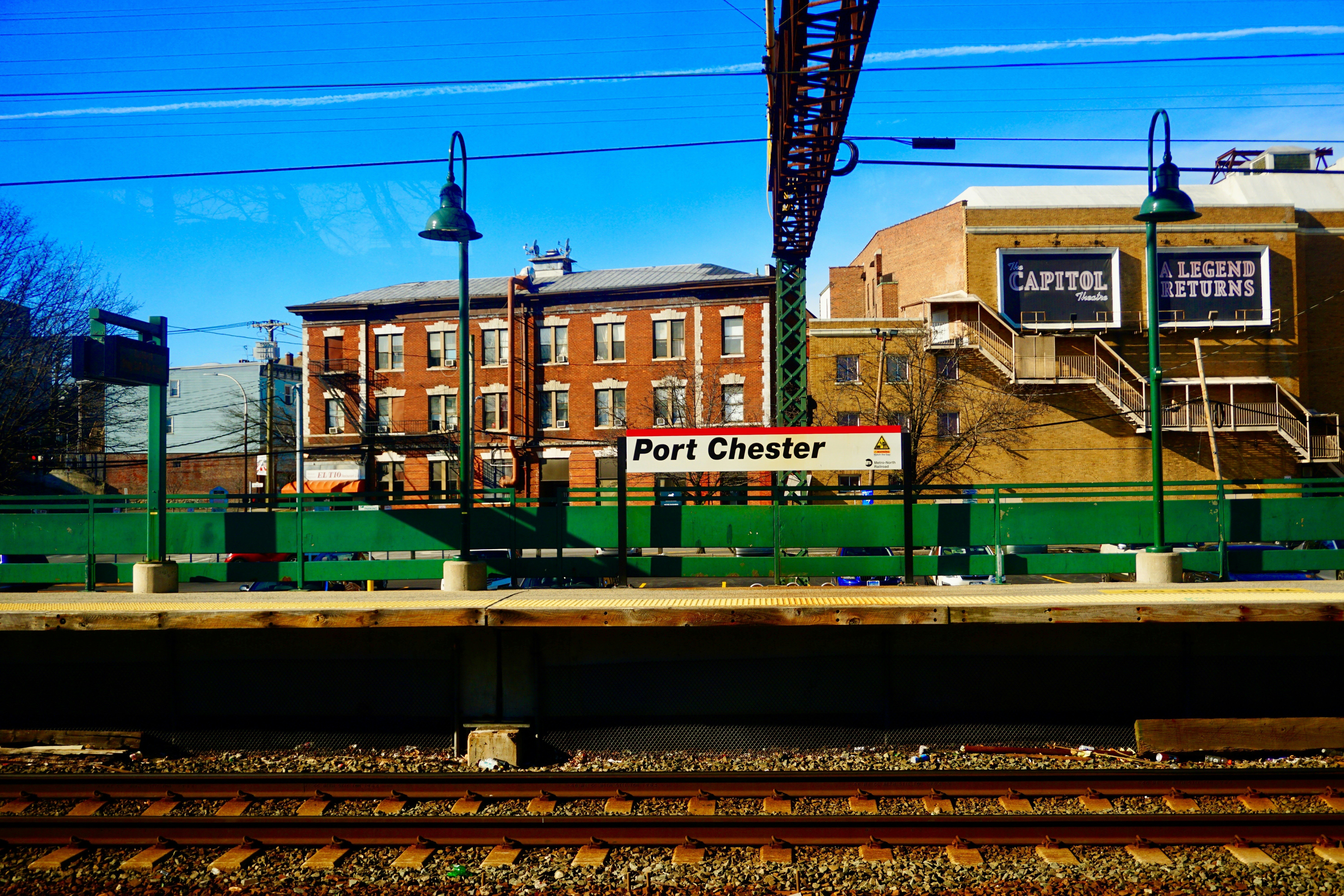 Port Chester road signage near train railway photo – Free Railway Image ...