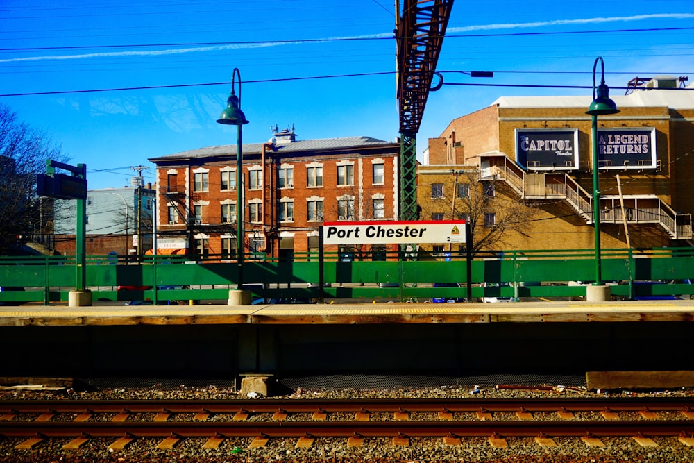 Port Chester road signage near train railway