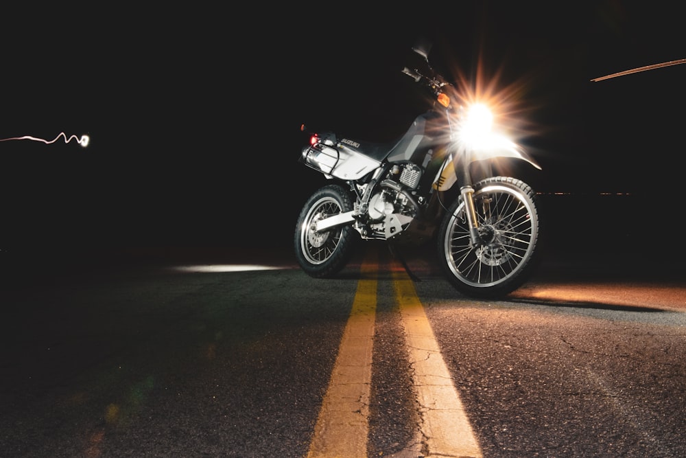 lighted headlight of parked motorcycle