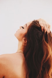 woman holding her hair