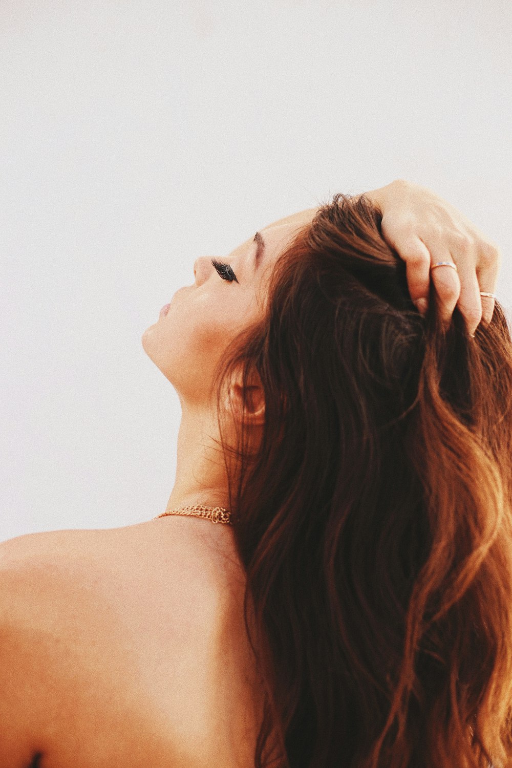 woman holding her hair