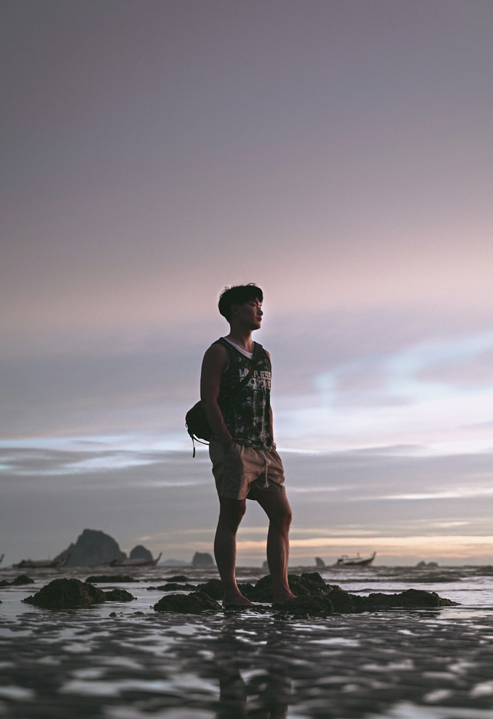 man standing on rocks