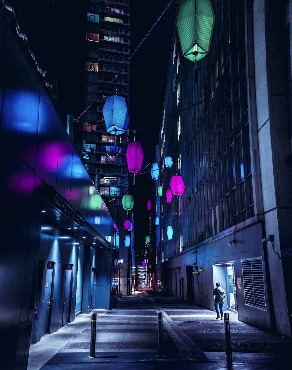 multicolored hanging lights beside concrete building
