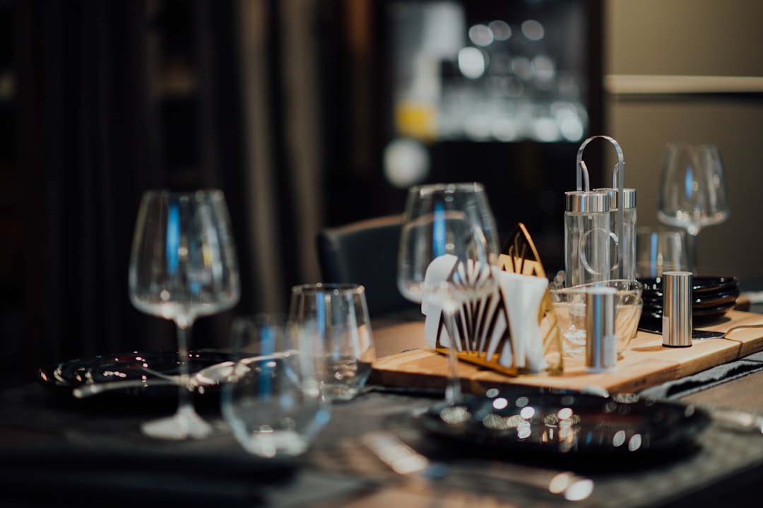 clear short-stem wine glasses on table near tray