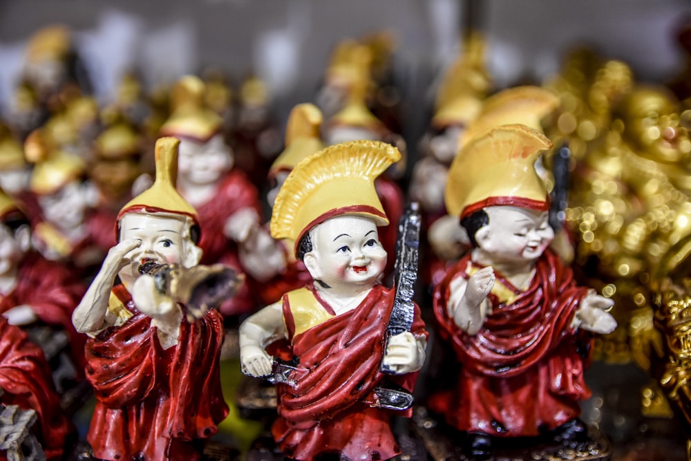 selective focus photography of boy holding black stick figurine