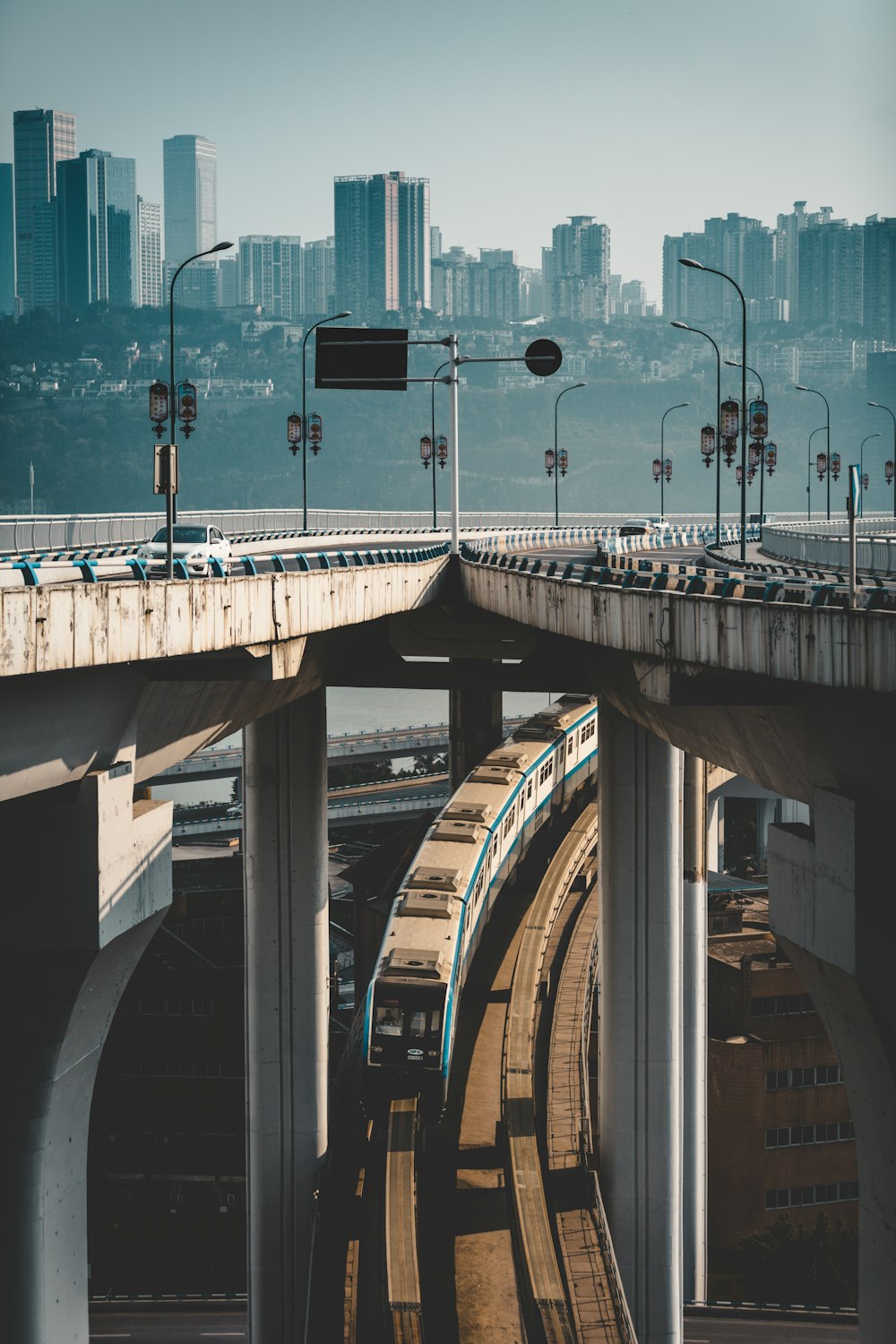 white and blue train passing on railway