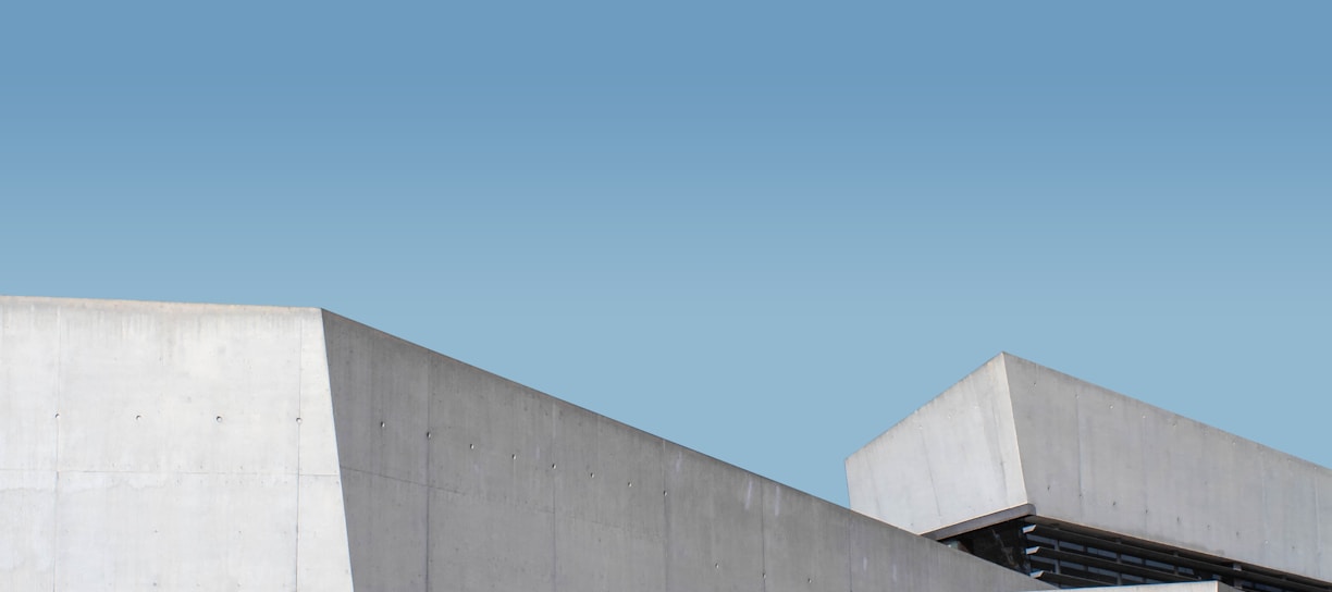 white concrete building under blue sky during daytime