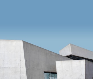 white concrete building under blue sky during daytime