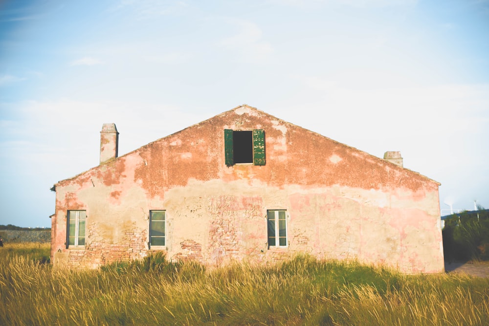 pink concrete house under white sky