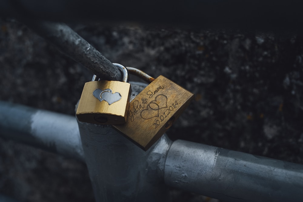 shallow focus photography of two brown padlocks