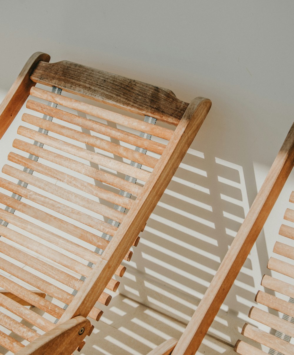 two vacant brown wooden loungers