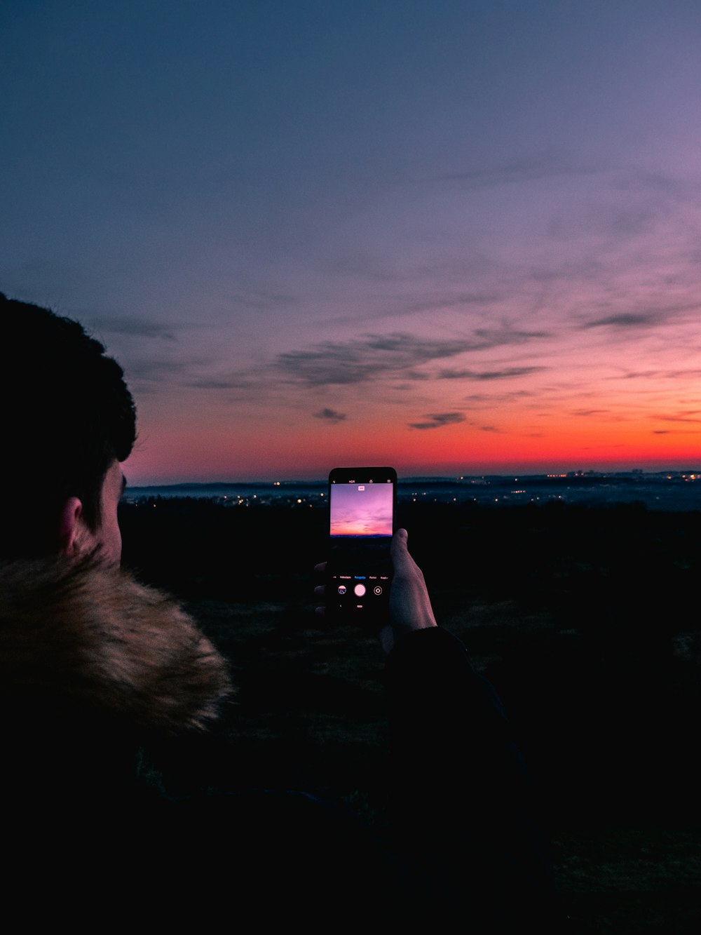 person taking photo of horizon