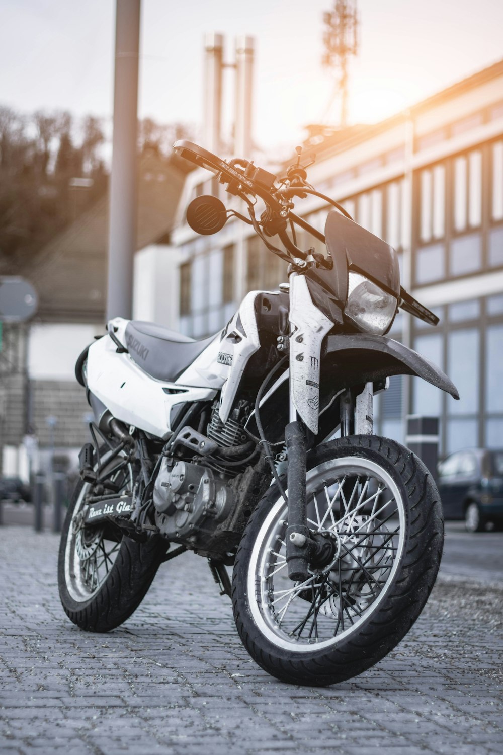 white and black motorcycle park during daytime