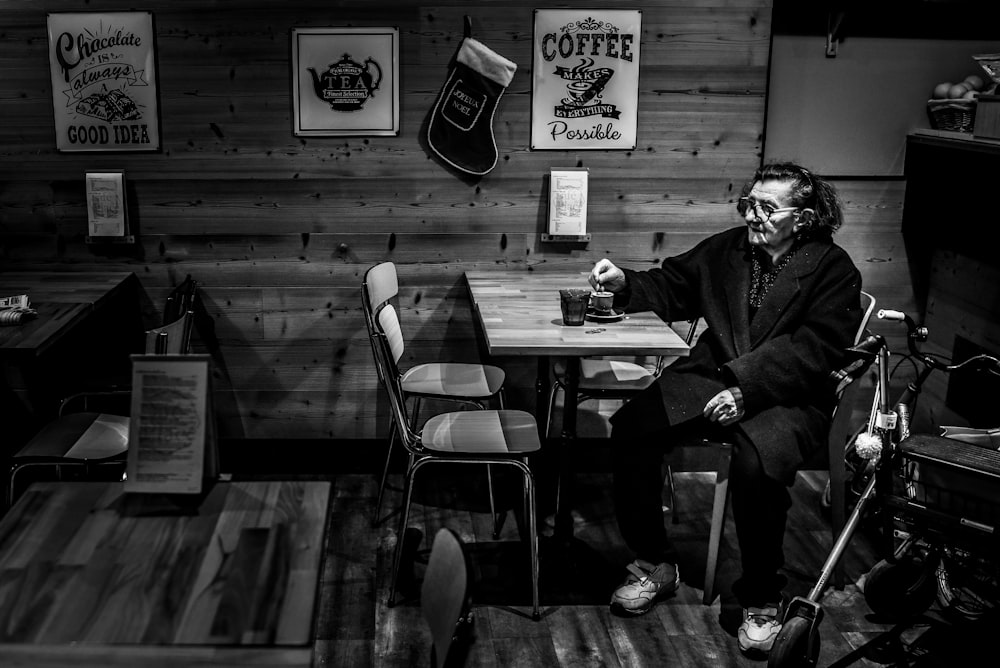 man sitting on chair at table