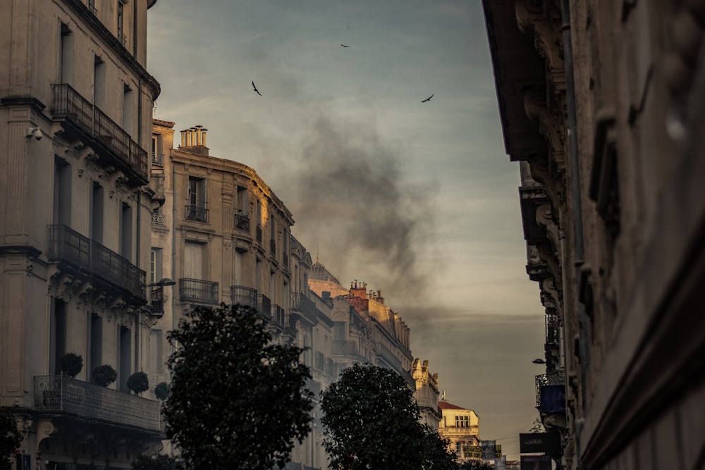 white concrete building with black smoke outdoor