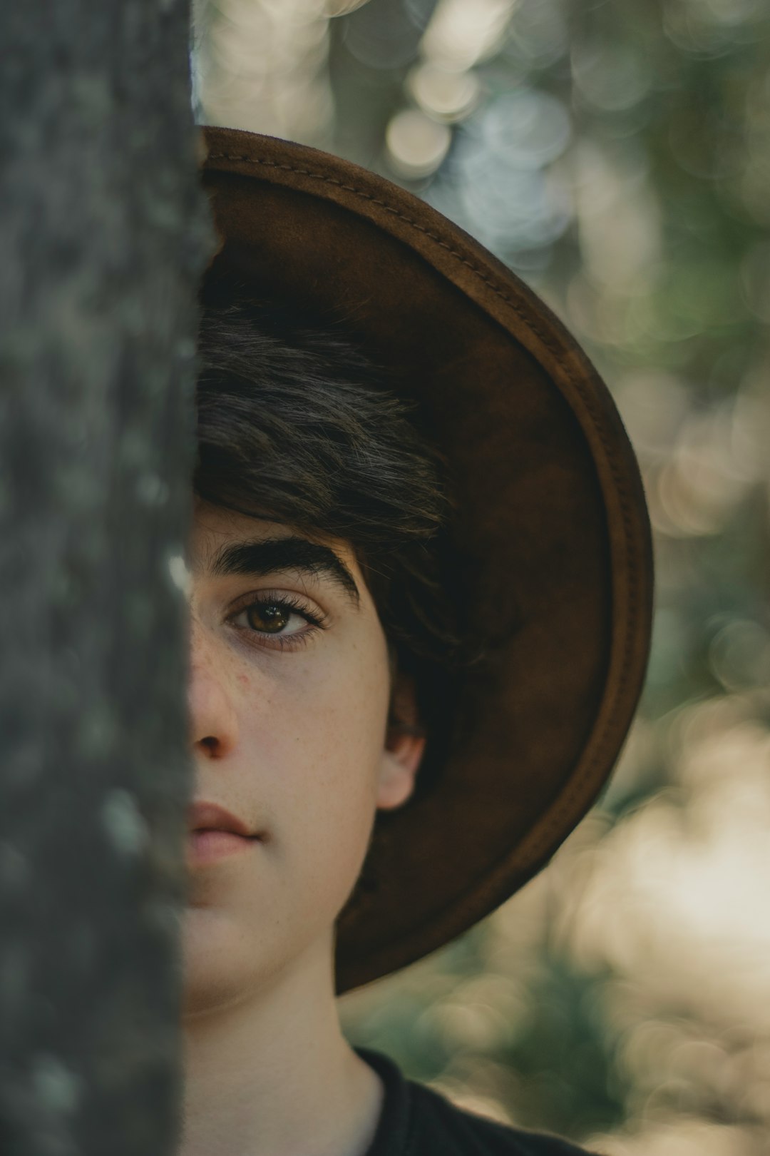 man wearing brown hat