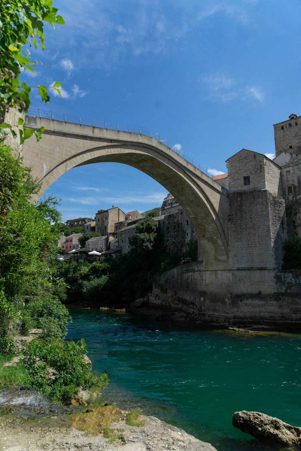 concrete structures beside body of water