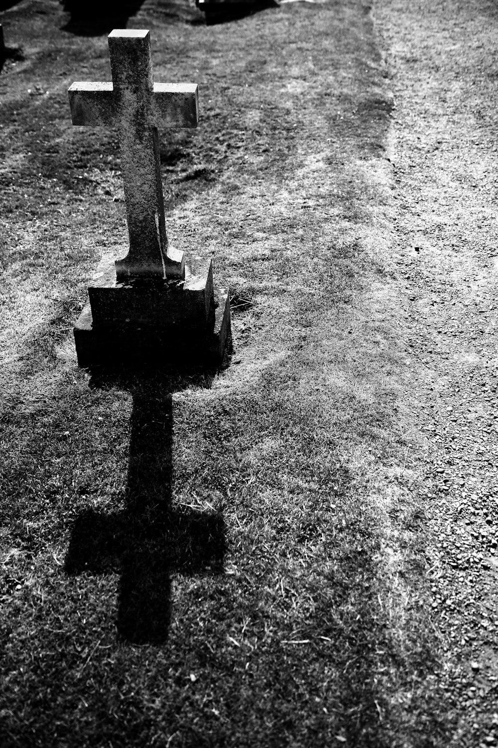 grayscale photography of gray tombstone