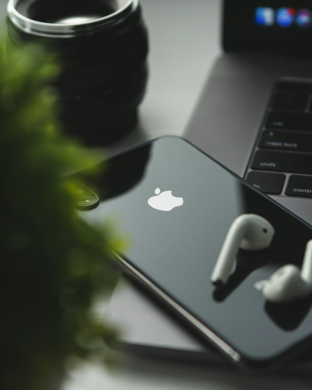 space gray iPhone X and Apple AirPods on MacBook Pro photo – Free Grey  Image on Unsplash