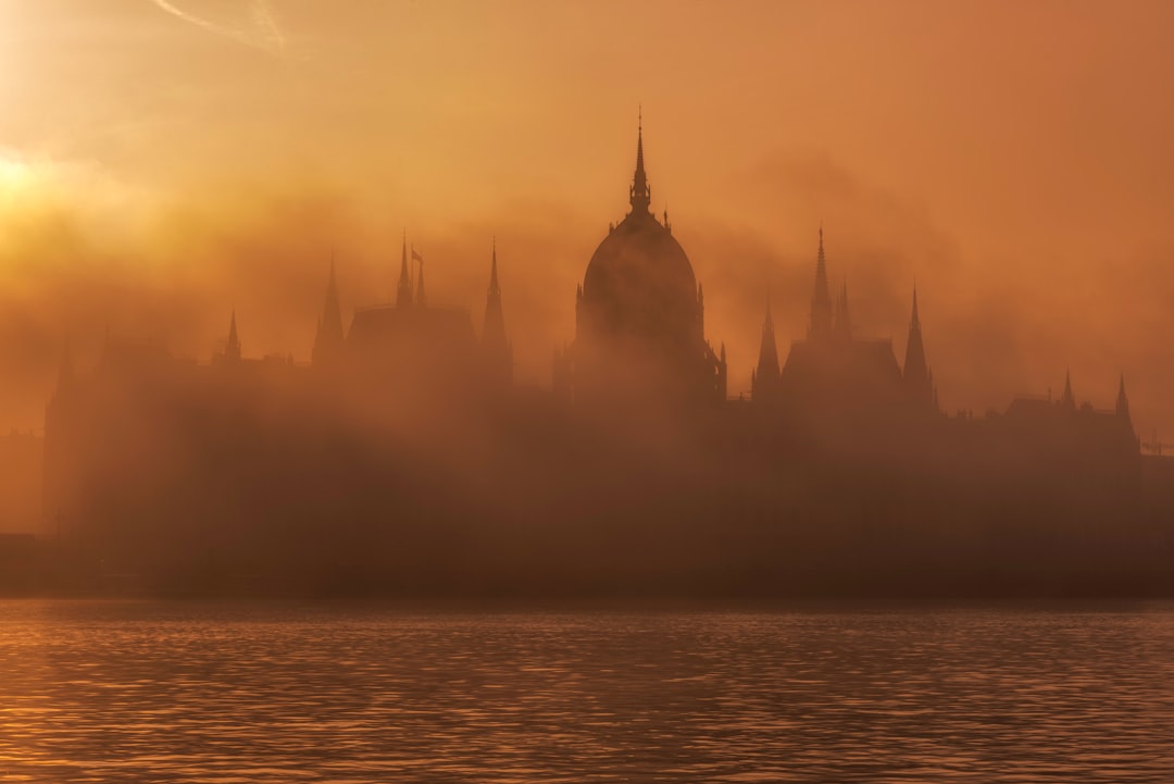 building near body of water during golden hour