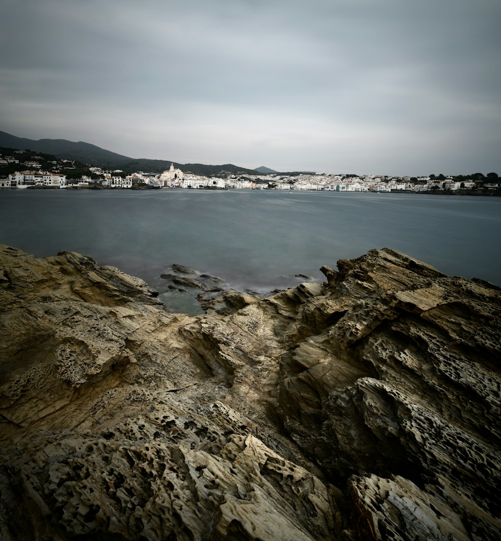 time lapse photography of body of water under gray skies