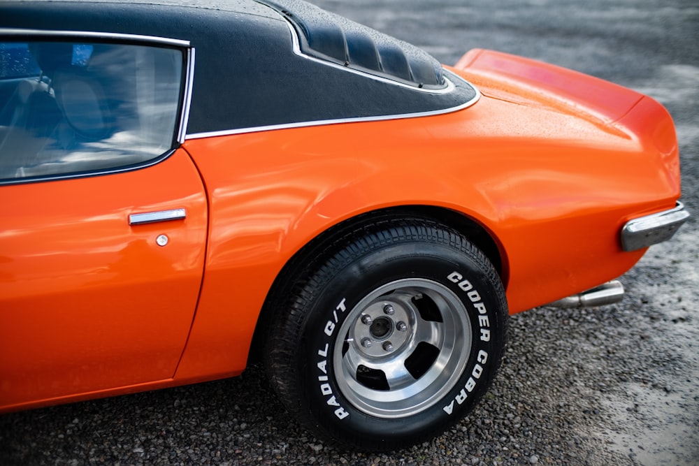 orange and black car in field