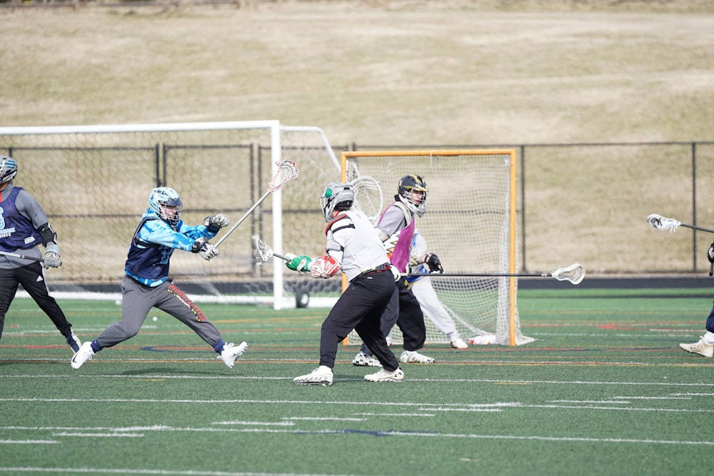 people playing lacrosse at the field