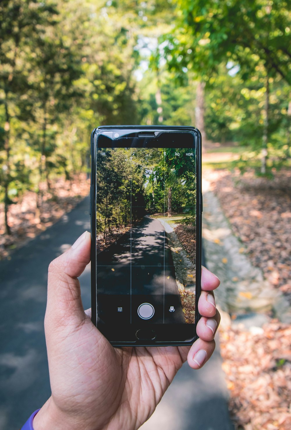 black smartphone on hand