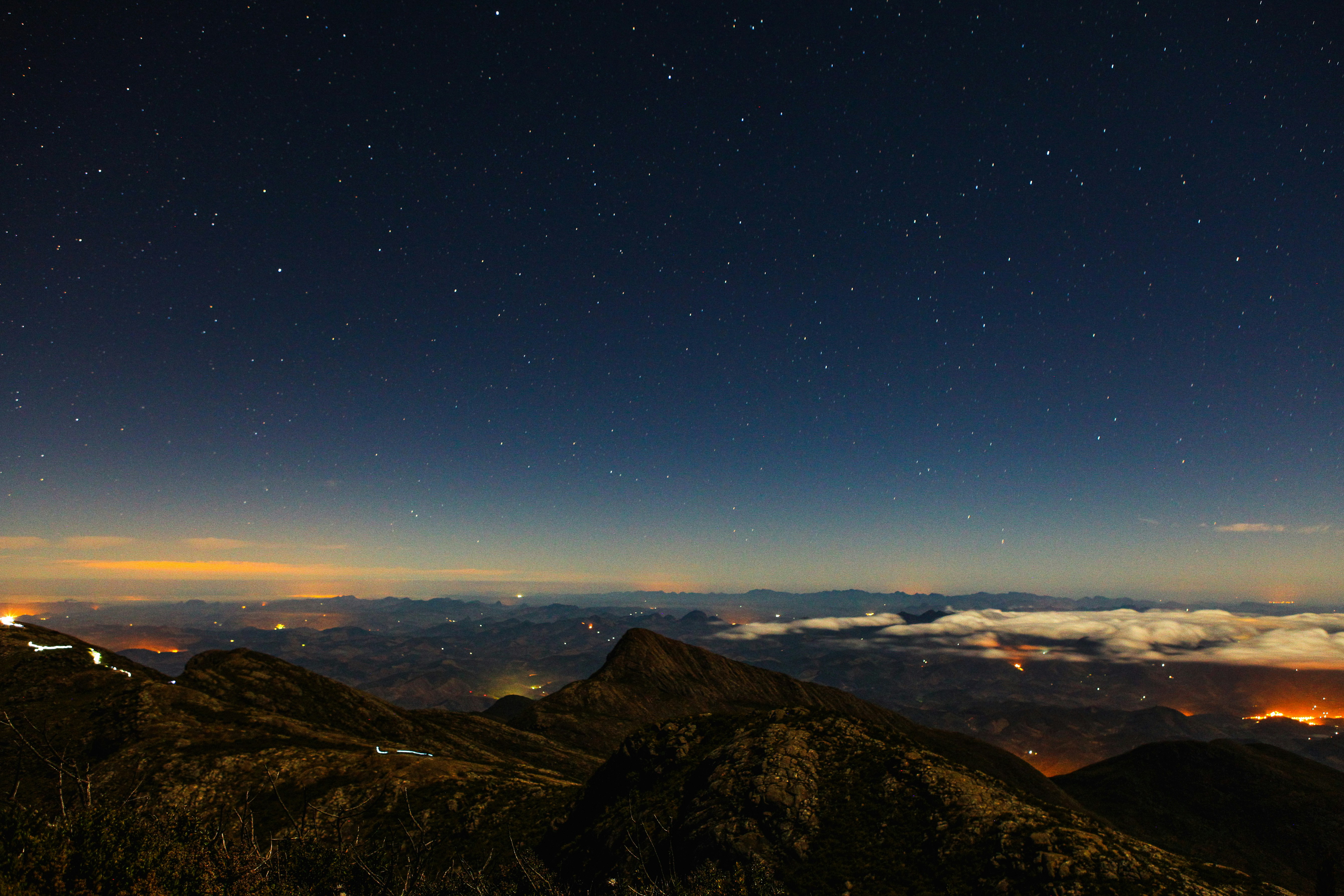 high-angle photography of brown mountains at night