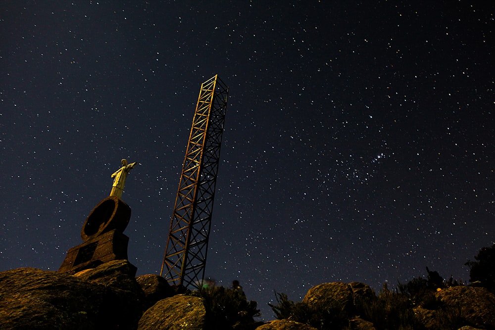 black tower under black sky