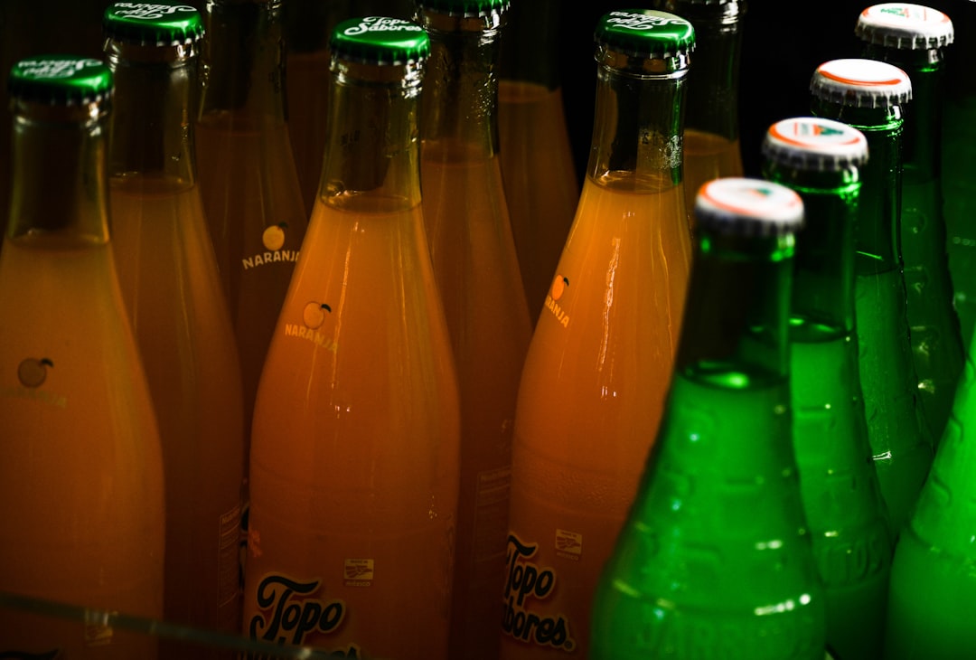 lot of orange and green soda bottles