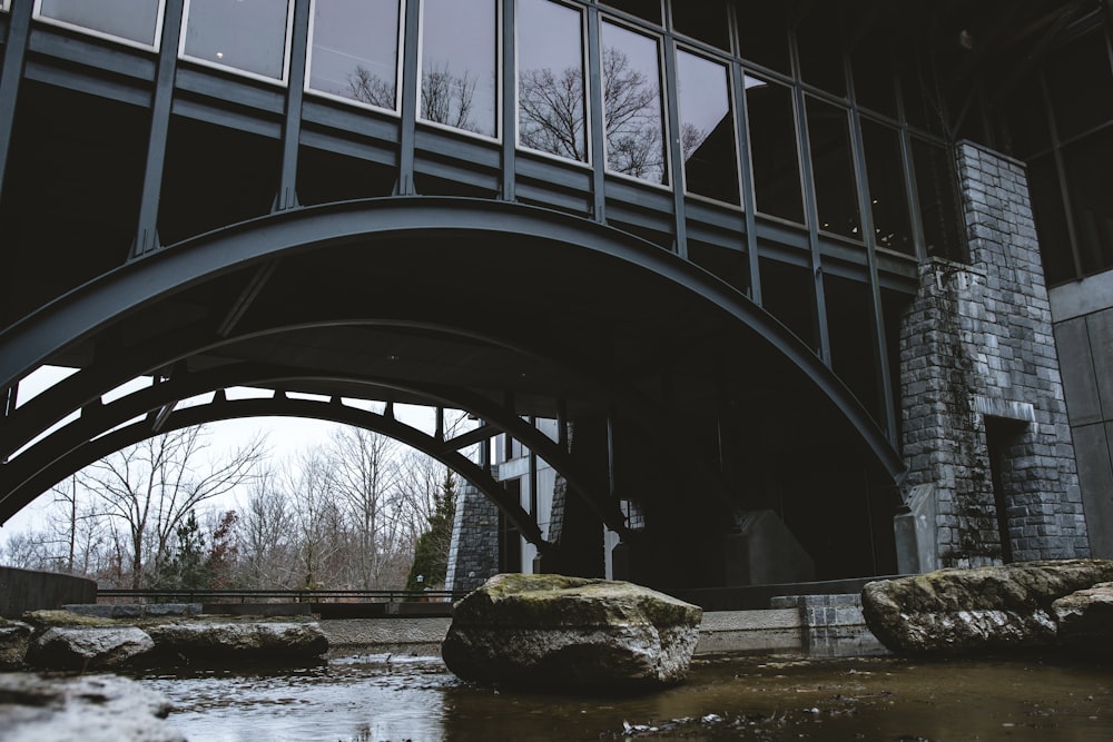 a bridge over a small stream in a park