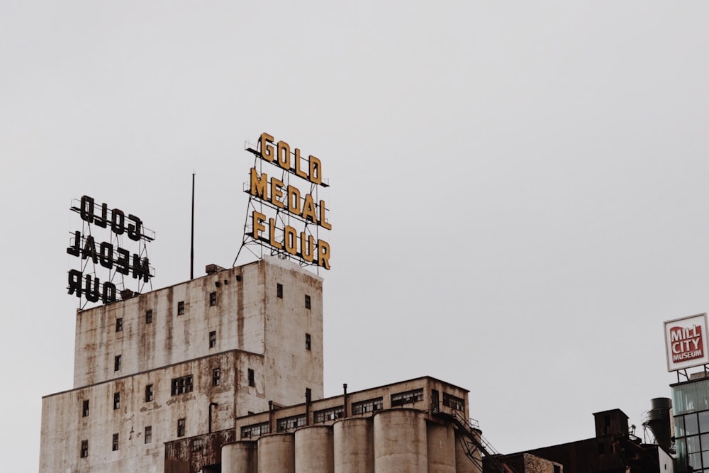 concrete building with lighted signage