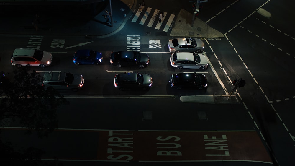 a group of cars that are sitting in the street