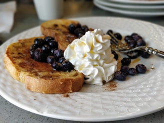 A beautifully plated French toast with berries.