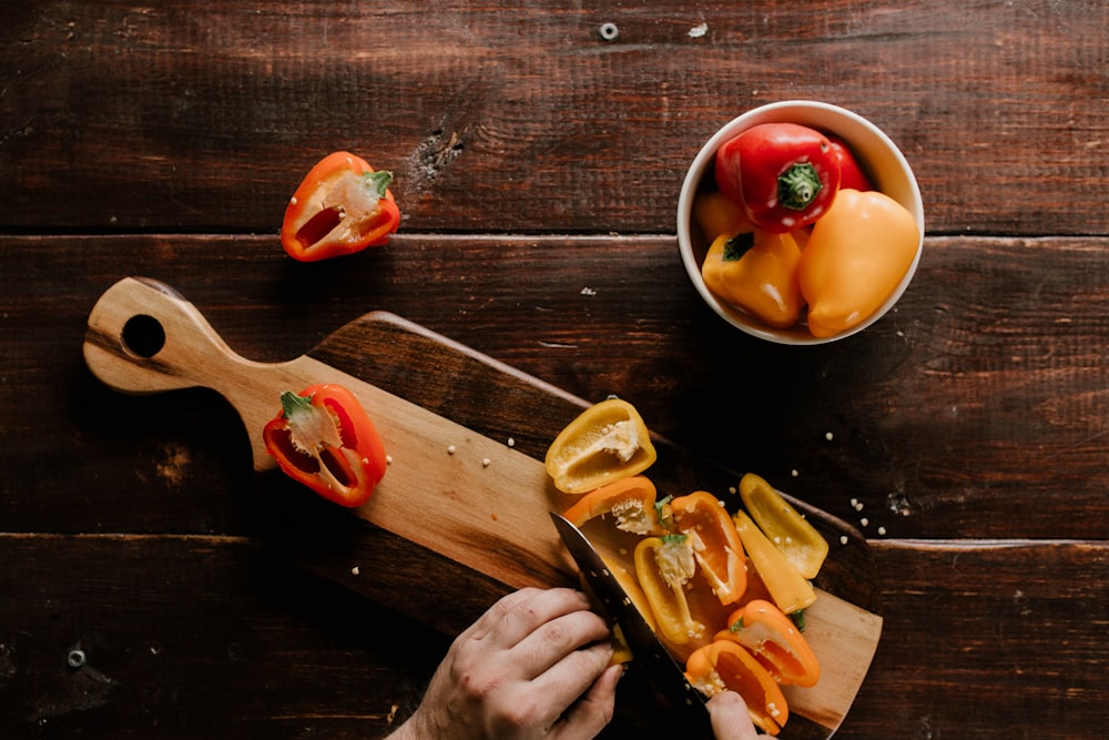 person slicing peppers