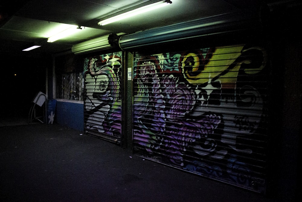 dimmed lighted alley with graffitis